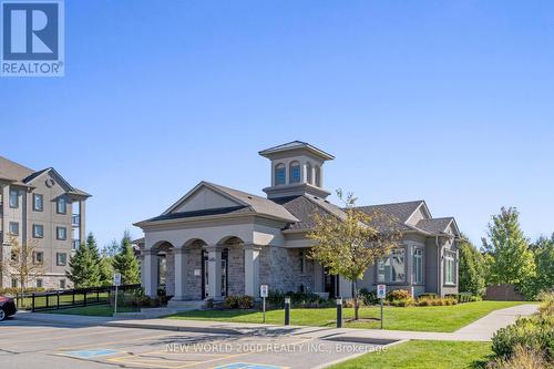 307 - 1440 Main Street E, Milton, ON - Outdoor With Facade