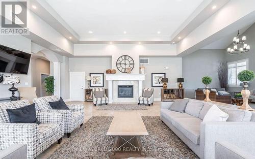 307 - 1440 Main Street E, Milton, ON - Indoor Photo Showing Living Room With Fireplace