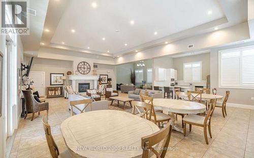 307 - 1440 Main Street E, Milton, ON - Indoor Photo Showing Dining Room With Fireplace