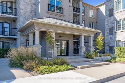 307 - 1440 Main Street E, Milton, ON - Outdoor With Balcony With Facade