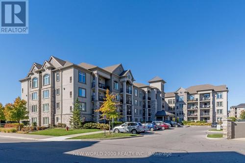 307 - 1440 Main Street E, Milton, ON - Outdoor With Balcony With Facade