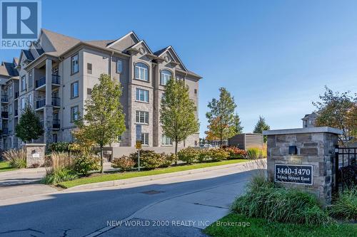 307 - 1440 Main Street E, Milton, ON - Outdoor With Facade