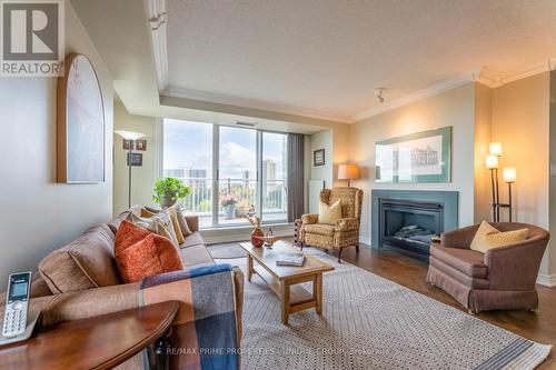 Ph 16 - 18 Concorde Place, Toronto, ON - Indoor Photo Showing Living Room With Fireplace