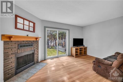 59 Sundback Lane, Ottawa, ON - Indoor Photo Showing Living Room With Fireplace