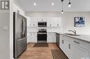 212 Cowan Crescent, Martensville, SK  - Indoor Photo Showing Kitchen With Double Sink 