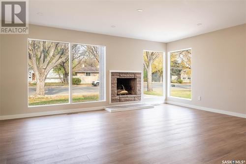 75 Sunset Drive, Regina, SK - Indoor Photo Showing Living Room With Fireplace