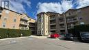 210 - 1460 Bishops Gate, Oakville, ON  - Outdoor With Balcony With Facade 