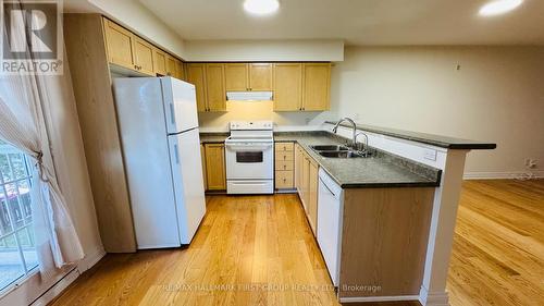 210 - 1460 Bishops Gate, Oakville, ON - Indoor Photo Showing Kitchen With Double Sink