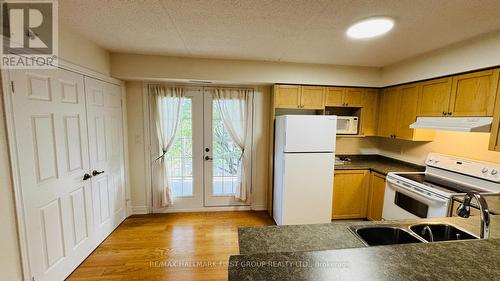 210 - 1460 Bishops Gate, Oakville, ON - Indoor Photo Showing Kitchen With Double Sink