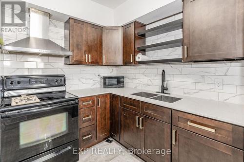 140 Gage Avenue N, Hamilton, ON - Indoor Photo Showing Kitchen With Double Sink