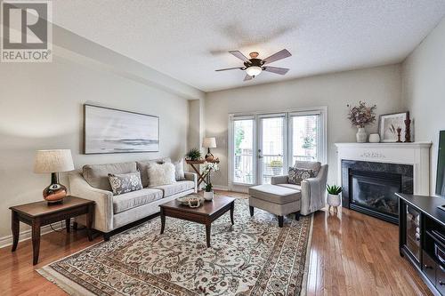 55 - 1169 Dorval Drive, Oakville, ON - Indoor Photo Showing Living Room With Fireplace