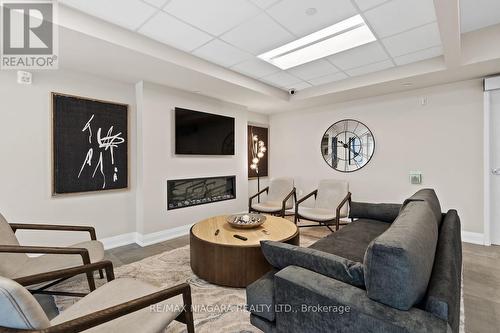 308 - 118 Summersides Boulevard, Pelham, ON - Indoor Photo Showing Living Room With Fireplace