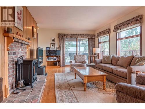 2150 Rashdale Road, Spallumcheen, BC - Indoor Photo Showing Living Room With Fireplace