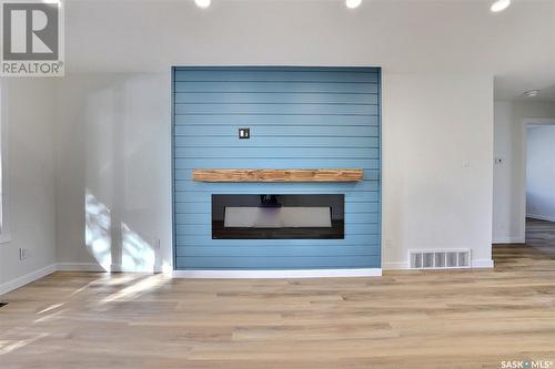 78 Deergrove Crescent, Regina, SK - Indoor Photo Showing Living Room With Fireplace