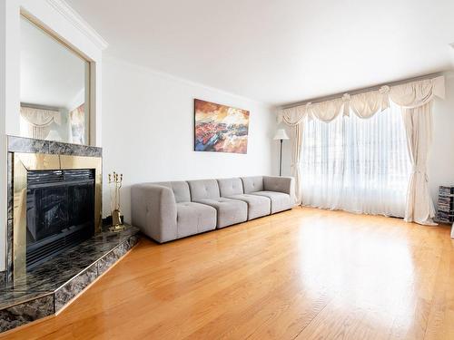 Salon - 3695 Rue Des Pétunias, Longueuil (Saint-Hubert), QC - Indoor Photo Showing Living Room With Fireplace