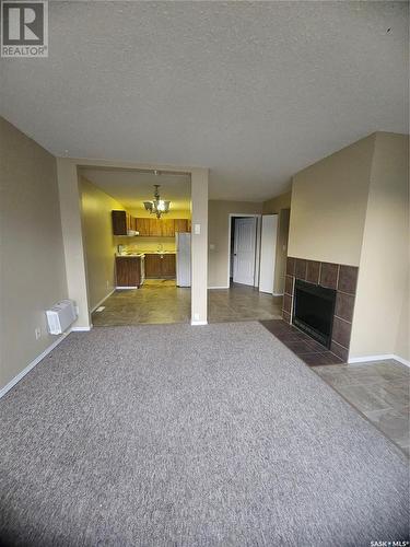 104 521 Albert Street, Estevan, SK - Indoor With Fireplace