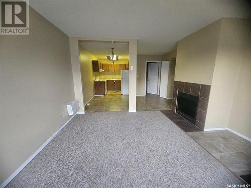 104 521 Albert Street, Estevan, SK - Indoor Photo Showing Other Room With Fireplace