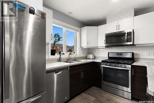 5540 Prefontaine Avenue, Regina, SK - Indoor Photo Showing Kitchen With Stainless Steel Kitchen With Double Sink