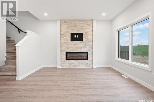 126 Antonini Court, Saskatoon, SK - Indoor With Fireplace