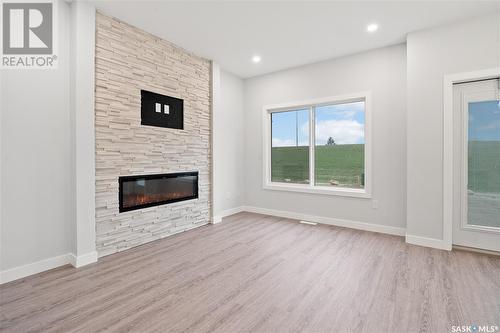 126 Antonini Court, Saskatoon, SK - Indoor Photo Showing Living Room With Fireplace