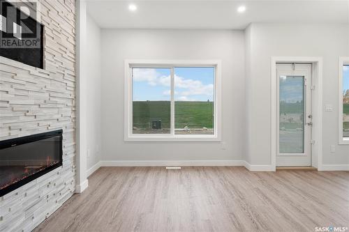 126 Antonini Court, Saskatoon, SK - Indoor With Fireplace