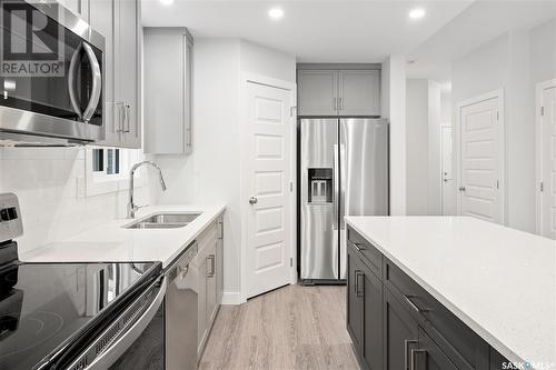 126 Antonini Court, Saskatoon, SK - Indoor Photo Showing Kitchen With Double Sink With Upgraded Kitchen