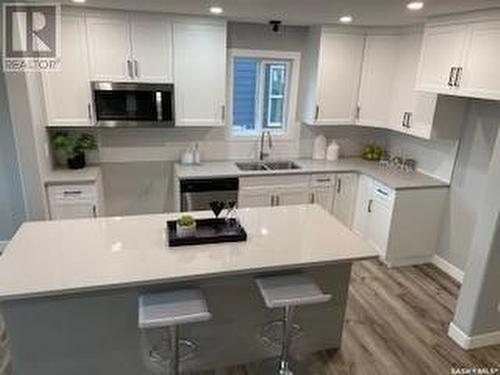 126 Antonini Court, Saskatoon, SK - Indoor Photo Showing Kitchen With Double Sink