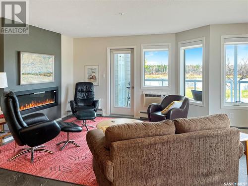 201 395 River Street E, Prince Albert, SK - Indoor Photo Showing Living Room With Fireplace