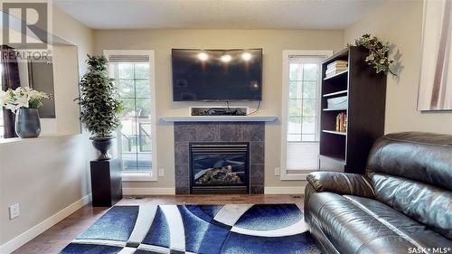 3341 Green Moss Lane, Regina, SK - Indoor Photo Showing Living Room With Fireplace