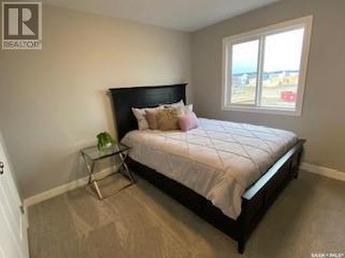 122 Antonini Court, Saskatoon, SK - Indoor Photo Showing Bedroom