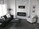 1019 Brighton Gate, Saskatoon, SK  - Indoor Photo Showing Living Room With Fireplace 