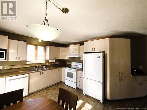 65 Des Prés Street, Edmundston, NB - Indoor Photo Showing Kitchen With Double Sink