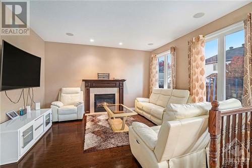 100 Monterossa Street, Ottawa, ON - Indoor Photo Showing Living Room With Fireplace