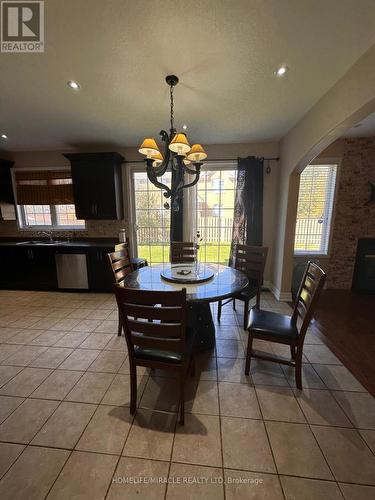 20 Latania Boulevard, Brampton, ON - Indoor Photo Showing Dining Room With Fireplace