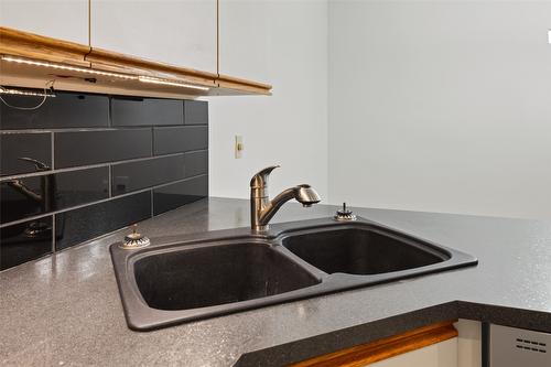 205-1249 Pacific Avenue, Kelowna, BC - Indoor Photo Showing Kitchen With Double Sink