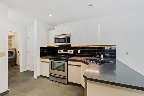 205-1249 Pacific Avenue, Kelowna, BC - Indoor Photo Showing Kitchen With Double Sink