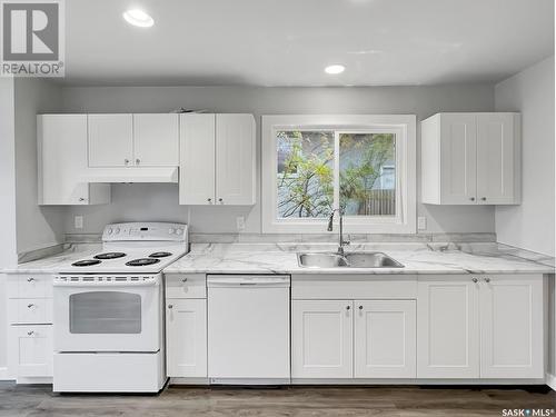 2714-2716 7Th Street E, Saskatoon, SK - Indoor Photo Showing Kitchen With Double Sink