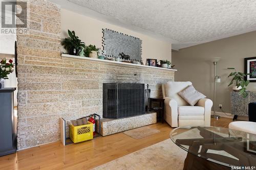 94 Academy Park Road, Regina, SK - Indoor Photo Showing Living Room With Fireplace