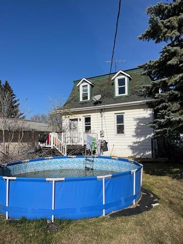 121 Aspen Street E, Oak Lake, MB - Outdoor With Above Ground Pool