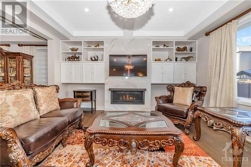 706 Fenwick Way, Barrhaven (7708 - Barrhaven - Stonebridge), ON - Indoor Photo Showing Living Room With Fireplace