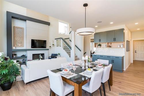 45 Crocus Lane, West St Paul, MB - Indoor Photo Showing Dining Room With Fireplace