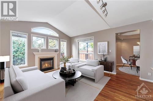 Virtually staged family room - 44 Grengold Way, Ottawa, ON - Indoor Photo Showing Living Room With Fireplace