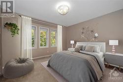 Virtually staged secondary bedroom does not include curtains or rods - 