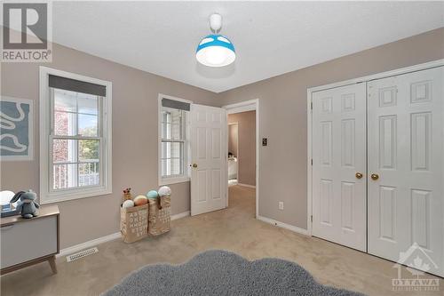 Virtually staged secondary bedroom does not include roll-down blinds - 44 Grengold Way, Ottawa, ON - Indoor Photo Showing Bedroom