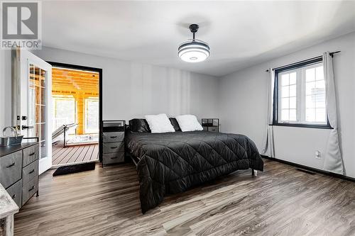 Primary bedroom and sunporch with hot tub. - 1502 South Lavant Road, Lanark Highlands, ON - Indoor Photo Showing Bedroom