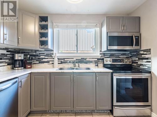 153 - 120 Nonquon Road, Oshawa, ON - Indoor Photo Showing Kitchen With Stainless Steel Kitchen With Double Sink