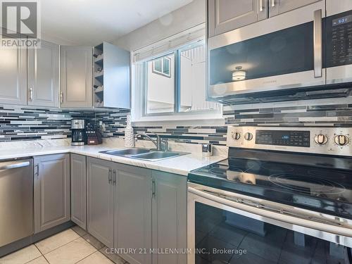 153 - 120 Nonquon Road, Oshawa, ON - Indoor Photo Showing Kitchen With Stainless Steel Kitchen With Double Sink