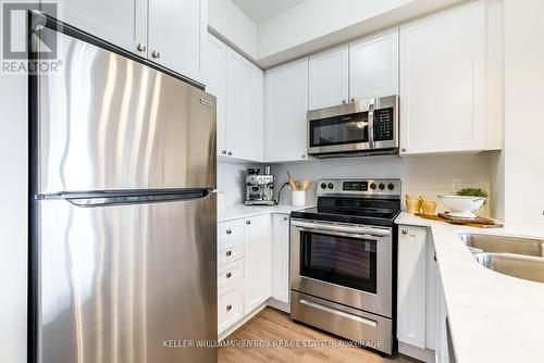 412 - 65 Shipway Avenue, Clarington (Newcastle), ON - Indoor Photo Showing Kitchen With Stainless Steel Kitchen With Double Sink With Upgraded Kitchen