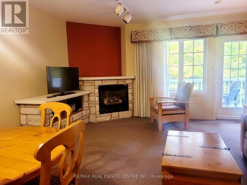 2340 - 90 Highland Drive, Oro-Medonte, ON - Indoor Photo Showing Living Room With Fireplace