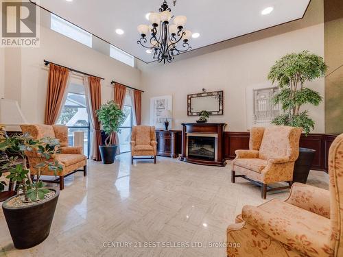 601 - 3650 Kaneff Crescent, Mississauga, ON - Indoor Photo Showing Living Room With Fireplace